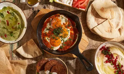 Charming Emirati breakfast spread at the cozy Arabian Tea House.