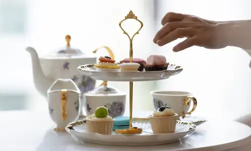 A delicate selection of sweets and macarons served in a luxurious setting at Sahn Eddar.