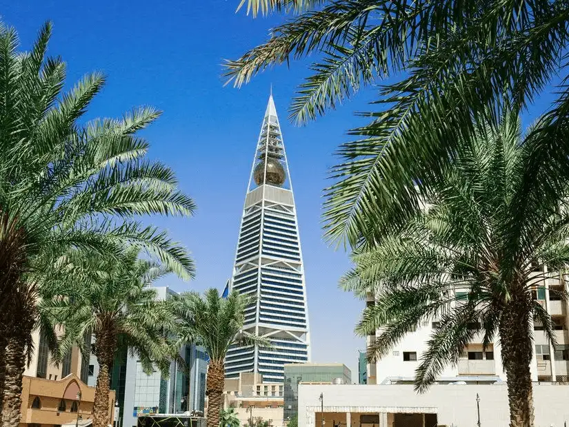 Modern architecture meets lush greenery at the base of Al Faisaliah Tower.