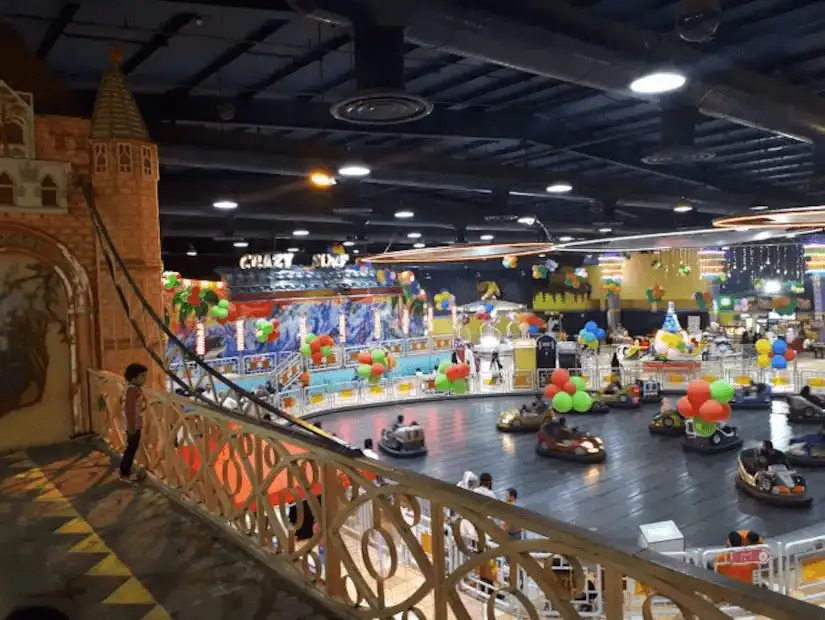 A vibrant and colorful indoor amusement park filled with excitement.