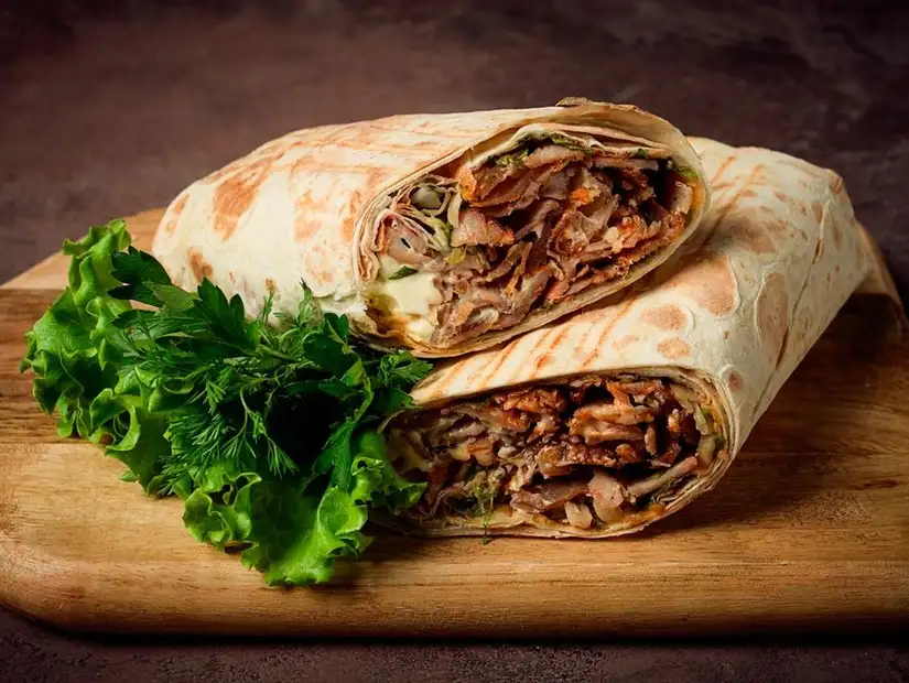 A hearty shawarma wrap with fresh greens.