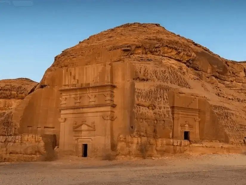 The warm glow of the sunset on AlUla's rock-cut architecture.