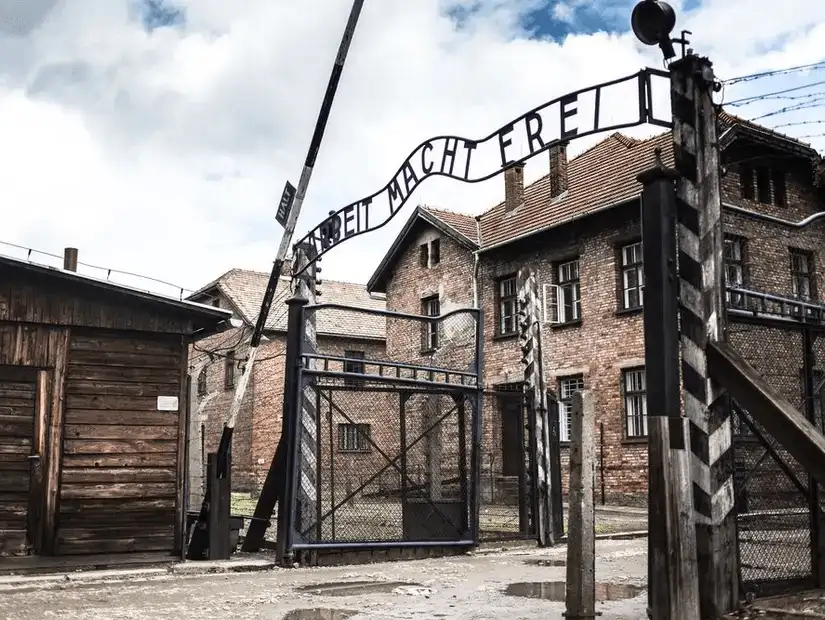 The infamous entrance to Auschwitz, with the chilling "Arbeit Macht Frei" sign, a stark reminder of the horrors of the Holocaust.