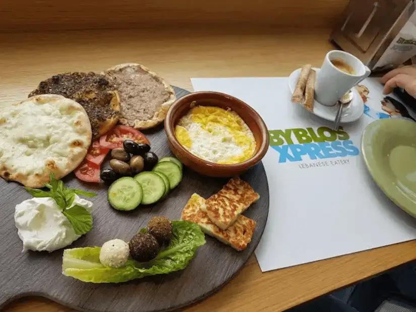 A traditional Lebanese breakfast spread with a variety of accompaniments.