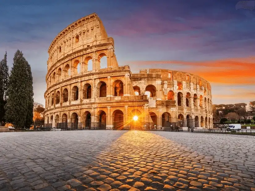 The iconic Colosseum glowing with the warmth of the rising sun.