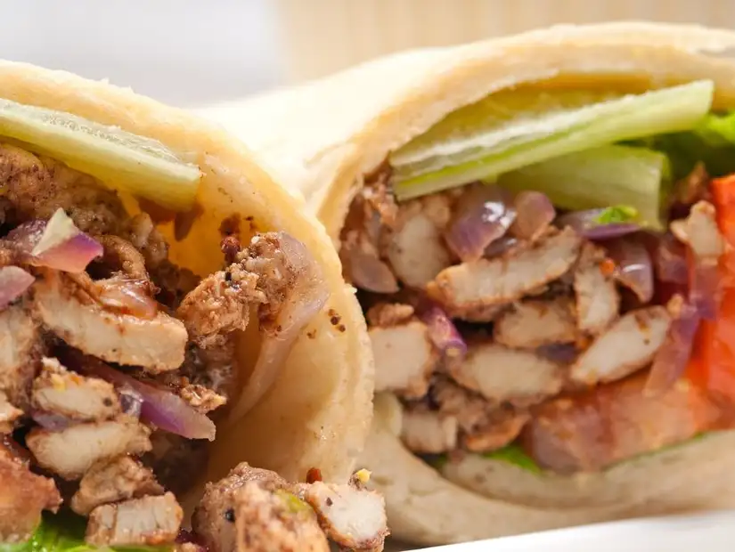 A close-up of a tasty chicken shawarma wrap.