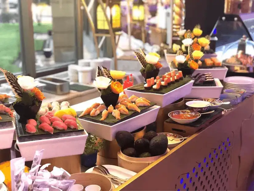 An elegant sushi display with an assortment of rolls and sashimi.