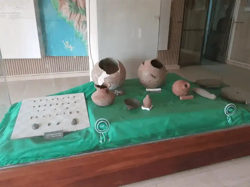 A display of traditional pottery and an ancient board game, offering a glimpse into the region's rich cultural heritage.