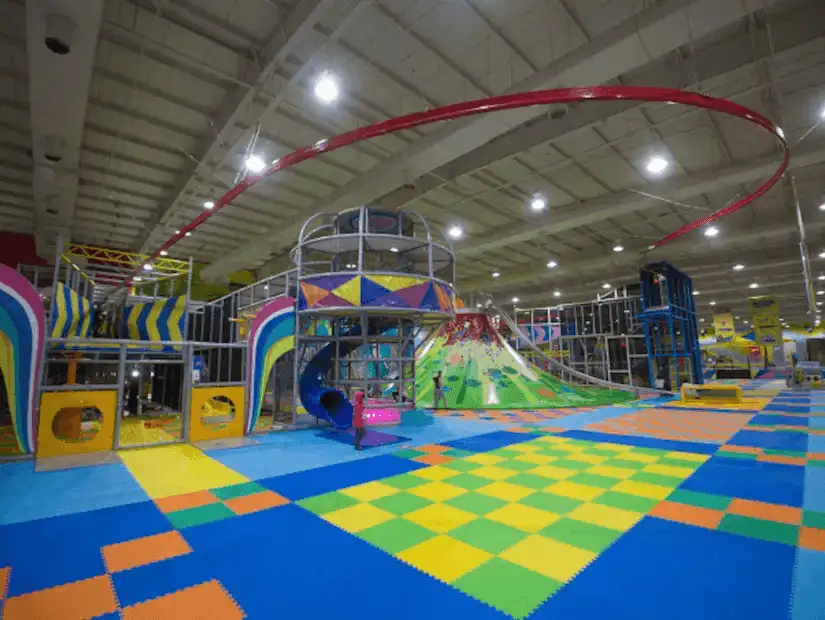 Colorful indoor playground with various play structures at Jumpoline.