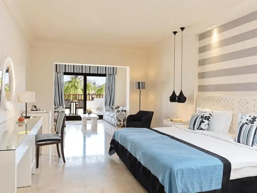 A chic hotel room with a seaside balcony view at Juweira Boutique Hotel.