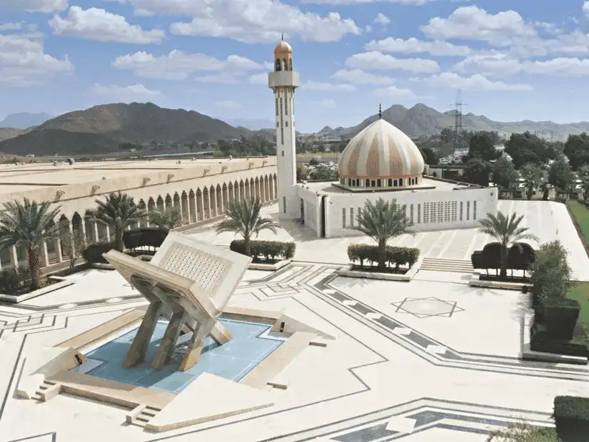 An aerial view of the King Fahd Complex, featuring its distinctive architecture and beautiful courtyard.