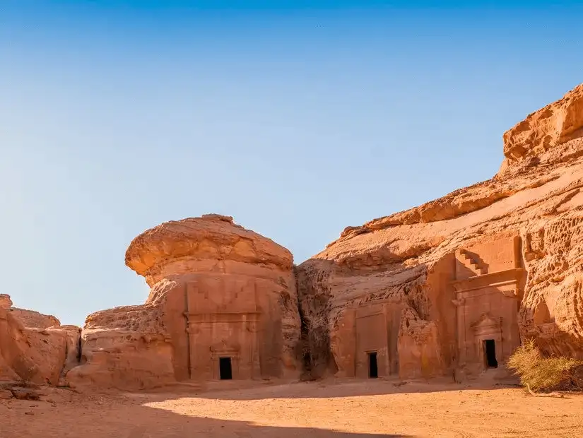 The ancient rock-cut tombs of Madain Saleh, standing out against the desert landscape.