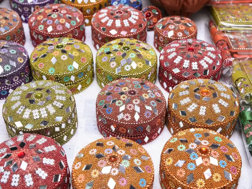 An assortment of intricately bejeweled boxes, each telling its own story of craftsmanship.
