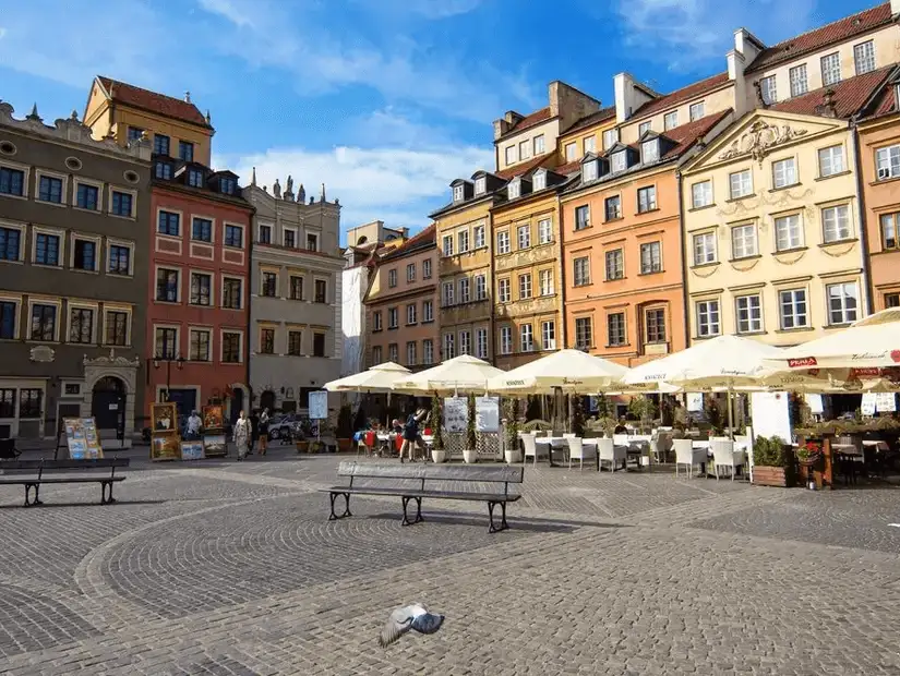 The charming Old Market Square in Poznań, surrounded by colorful historic buildings and lively cafés.