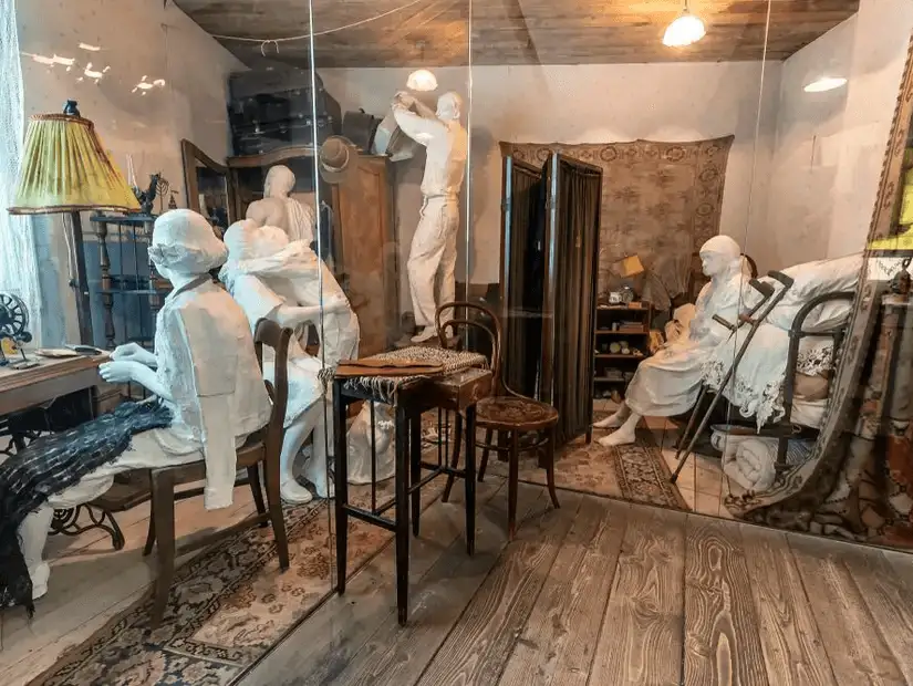 A haunting display of life-sized mannequins depicting a scene from Oscar Schindler's Enamel Factory during World War II.