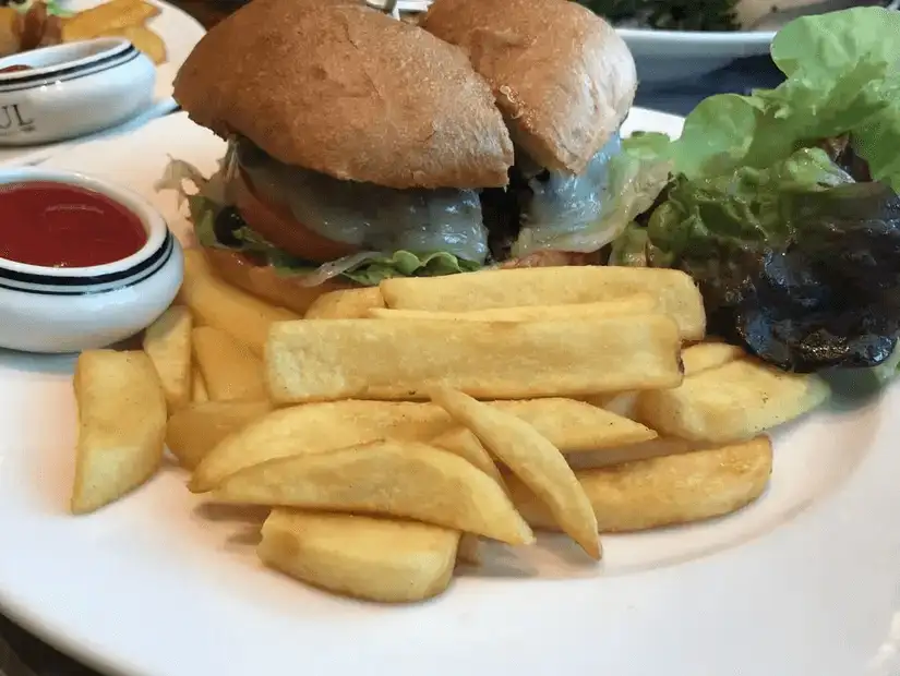 Classic cheeseburger with a side of fries and ketchup – the ultimate comfort food.