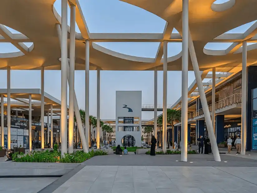 The contemporary design of Riverwalk Dining & Shopping Center, featuring open-air spaces and stylish structural elements.