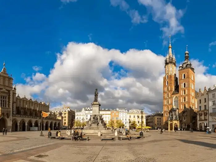 The vibrant Rynek Główny, Krakow's main square, surrounded by historical buildings and the iconic St. Mary's Basilica.