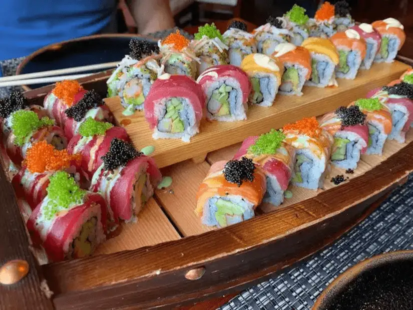 Assortment of sushi rolls adorned with colorful roe – a Japanese delicacy.