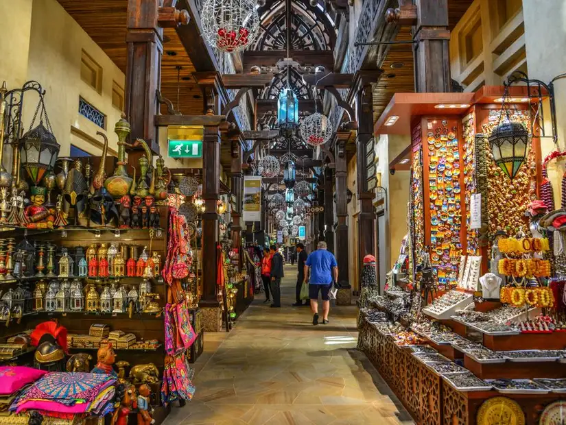 A vibrant alleyway brimming with colorful handicrafts and traditional wares, capturing the essence of Middle Eastern markets.