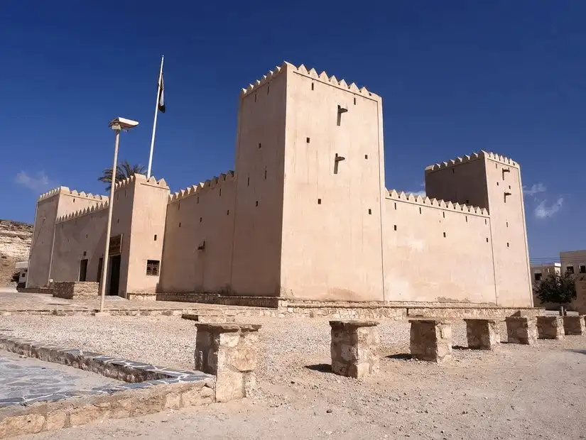 Historic Taqah Castle in Salalah stands firm under the clear blue sky.