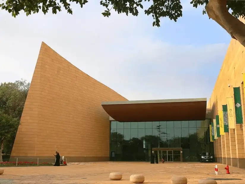 A modern museum facade, blending sharp angles with natural stone textures.