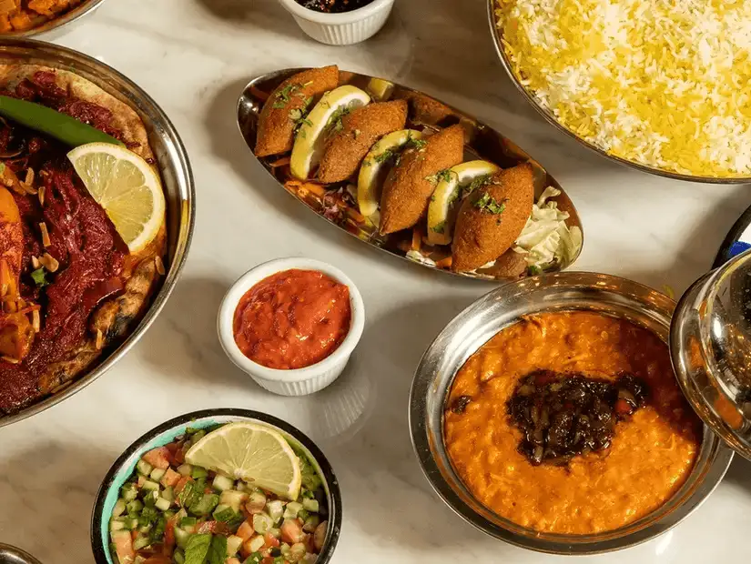 Traditional Middle Eastern dishes, including tahini, falafel, and flavorful meats, ready to be savored.