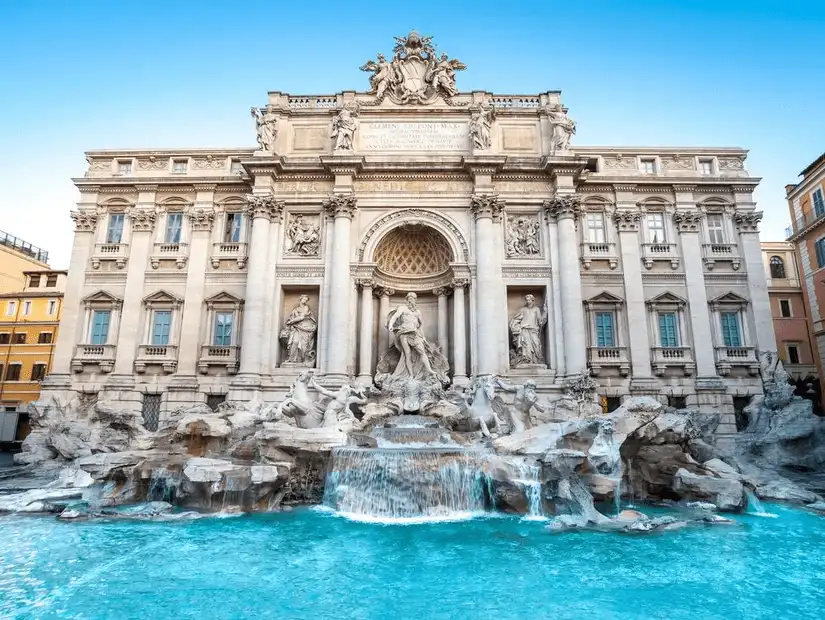 The majestic Trevi Fountain, sparkling in the morning light, inviting visitors to toss a coin.