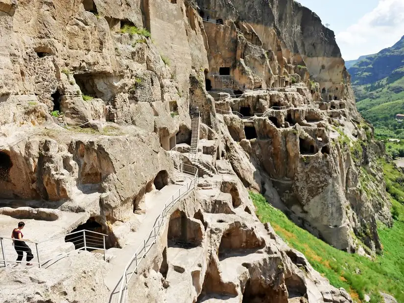 Tourists visiting Vardzia ancient cave monastery