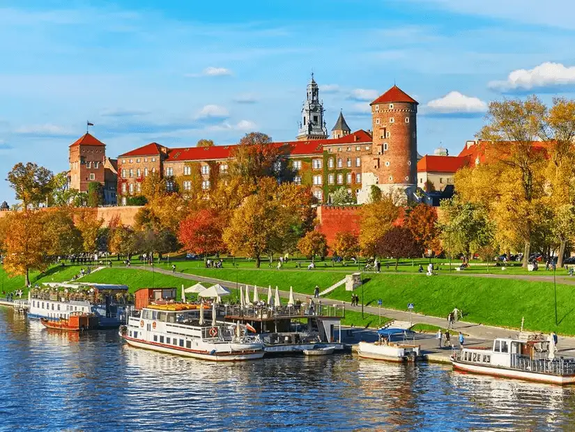 The majestic Wawel Royal Castle overlooking the Vistula River, a symbol of Polish history and pride.