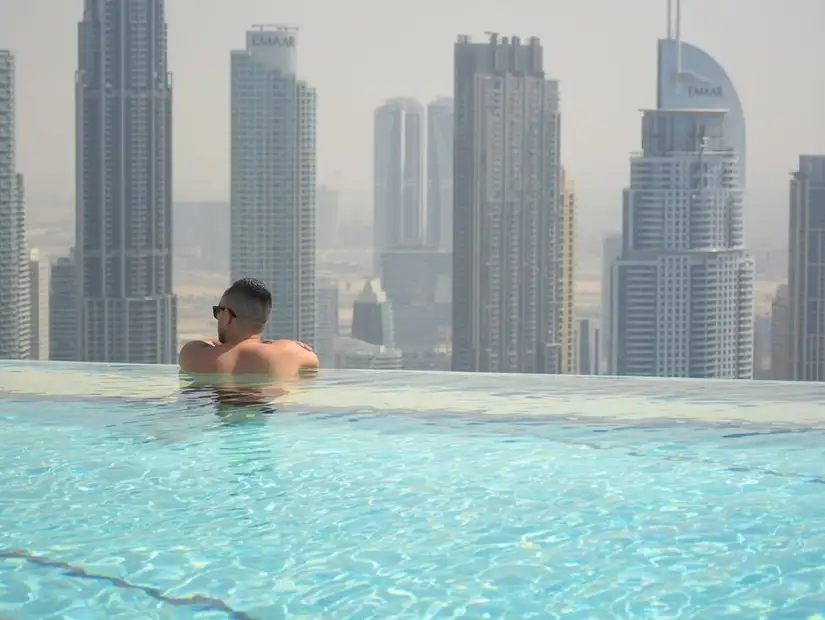 A scenic rooftop infinity pool at Address Sky View, with the iconic Burj Khalifa in view.