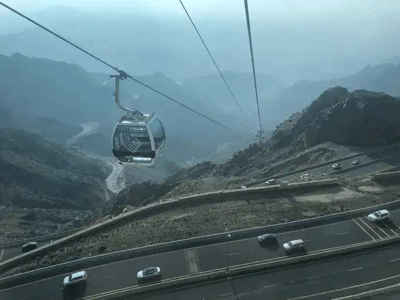 Cable car ride over the winding roads of Al Hada mountains.