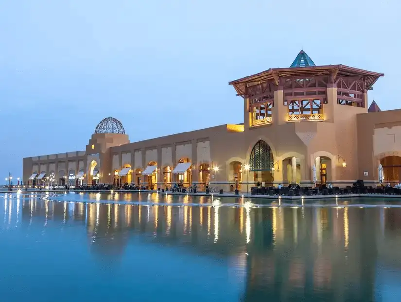 A beautiful evening view of Al Kout Mall, Kuwait’s popular shopping and entertainment destination by the water.