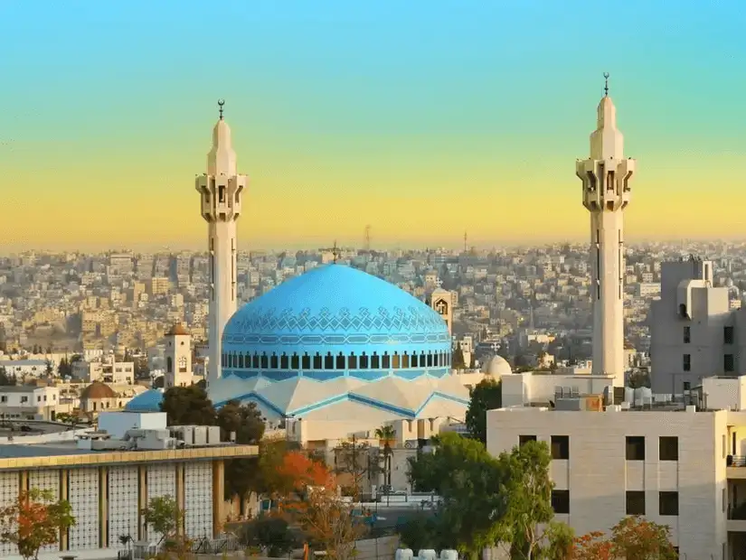 Stunning mosque with vibrant blue dome overlooking the sprawling city.