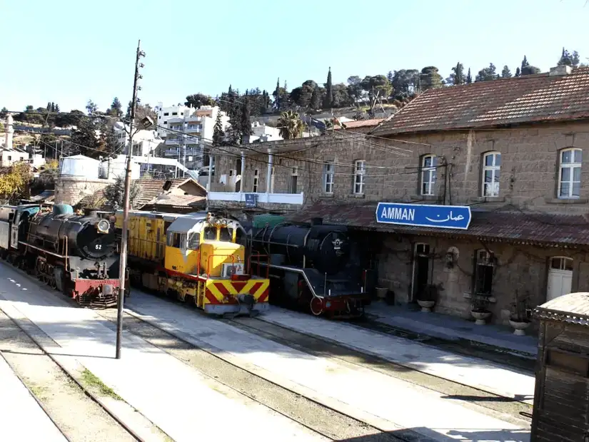 Historic train station in Amman, showcasing old locomotives and the timeless charm of rail travel.