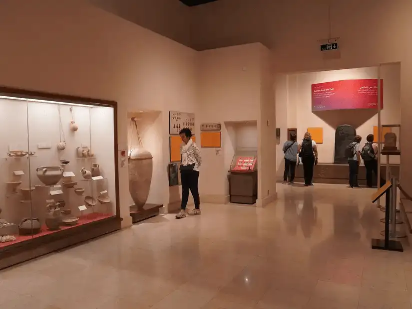 Visitors exploring ancient artifacts in a museum dedicated to regional history.