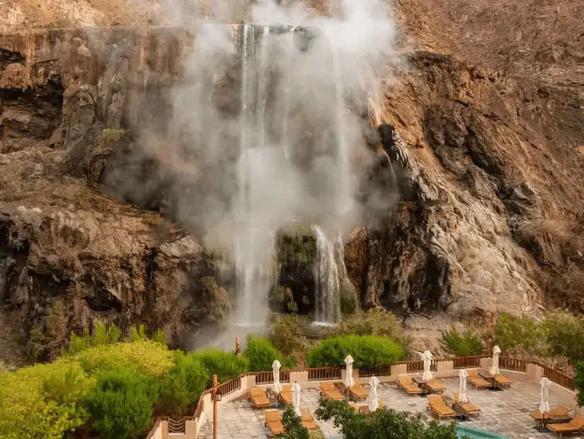 Dramatic waterfall oasis offering a natural retreat with modern amenities.