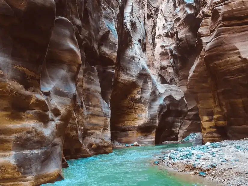 Serenity flows through the Siq in Petra, where ancient water channels carved from rose-red sandstone guide the way.