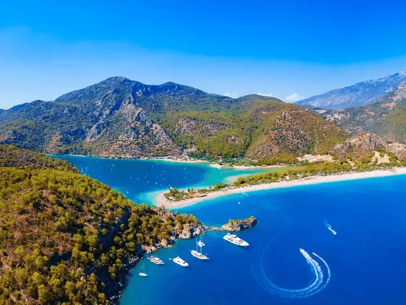 Stunning aerial view of the turquoise waters and lush greenery of Ölüdeniz Beach in Antalya.