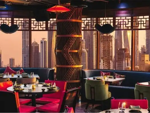 A fusion of flavors in an enchanting setting, framed by dramatic city views.