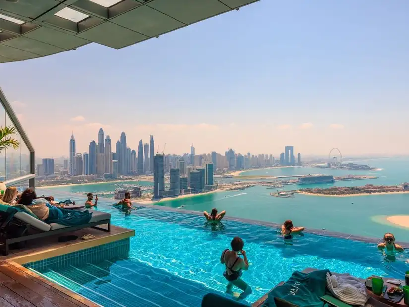 Spectacular views from Aura Skypool at Palm Tower, with a panoramic view of Dubai's coastline.