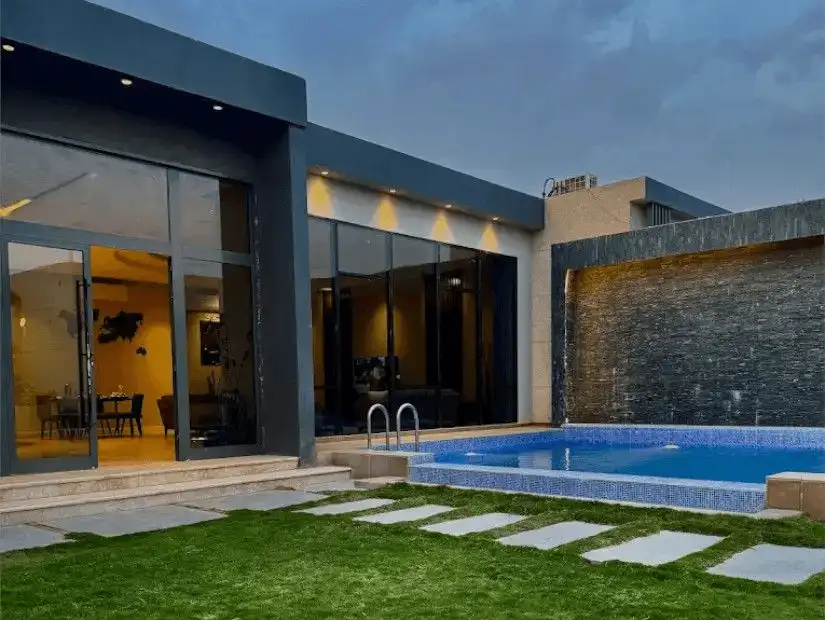 Chic chalet with a private pool and lush garden.