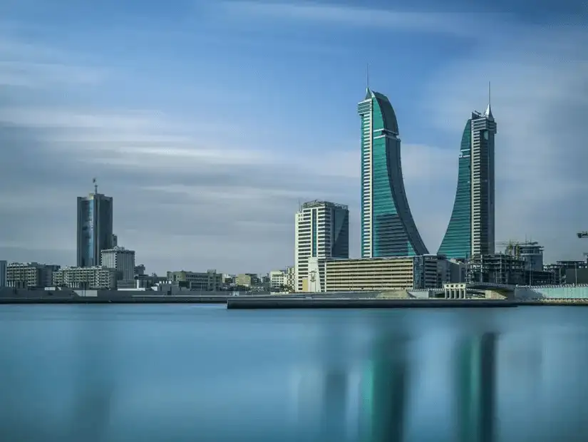 Bahrain Financial Harbour’s iconic towers standing tall by the calm waters.