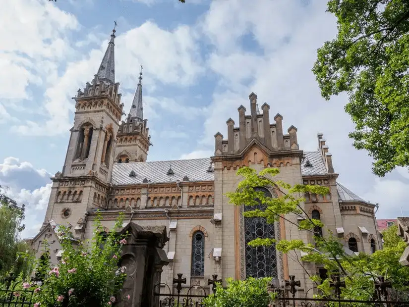 Gothic-style church with twin spires and intricate architecture.