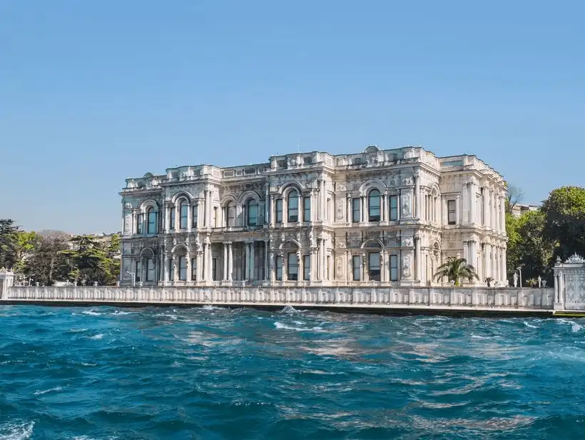 A historical waterfront palace overlooking the Bosphorus, with a grand architectural style.