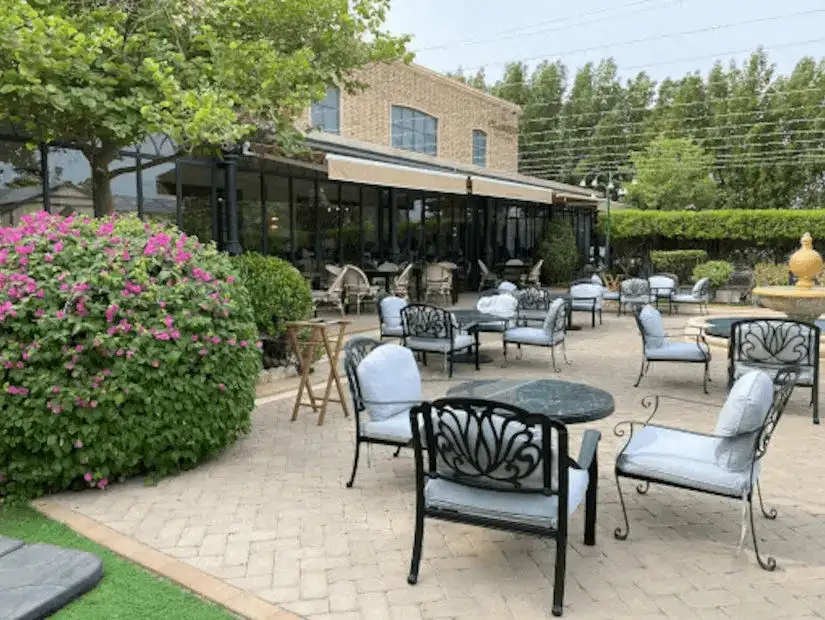 The chic and vibrant outdoor seating area of a café in Block 338, Bahrain’s popular dining and nightlife district.