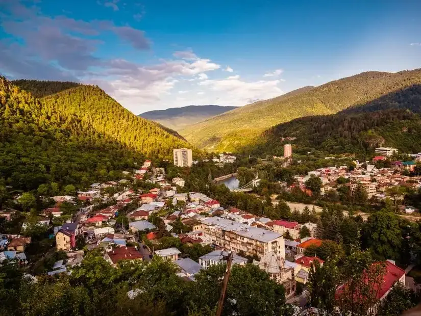 A panoramic view of Borjomi's green hills and buildings, capturing the harmony between nature and the town.