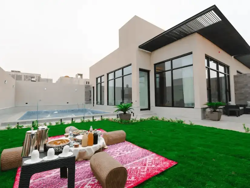 Stunning outdoor terrace with a pool and beautifully landscaped garden.