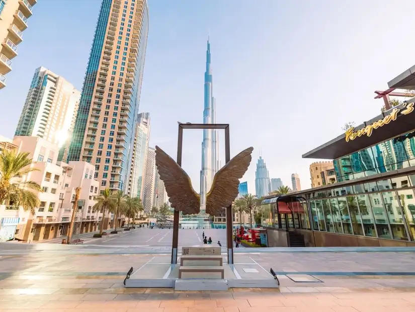 Iconic 'Wings of Mexico' sculpture with Burj Khalifa in the background at Burj Park.