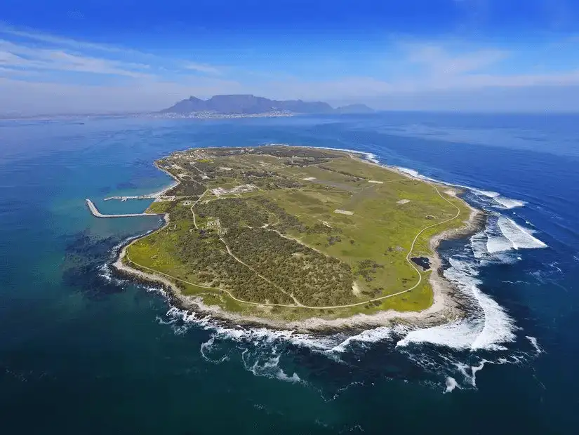 Scenic view of Robben Island surrounded by the deep blue ocean.